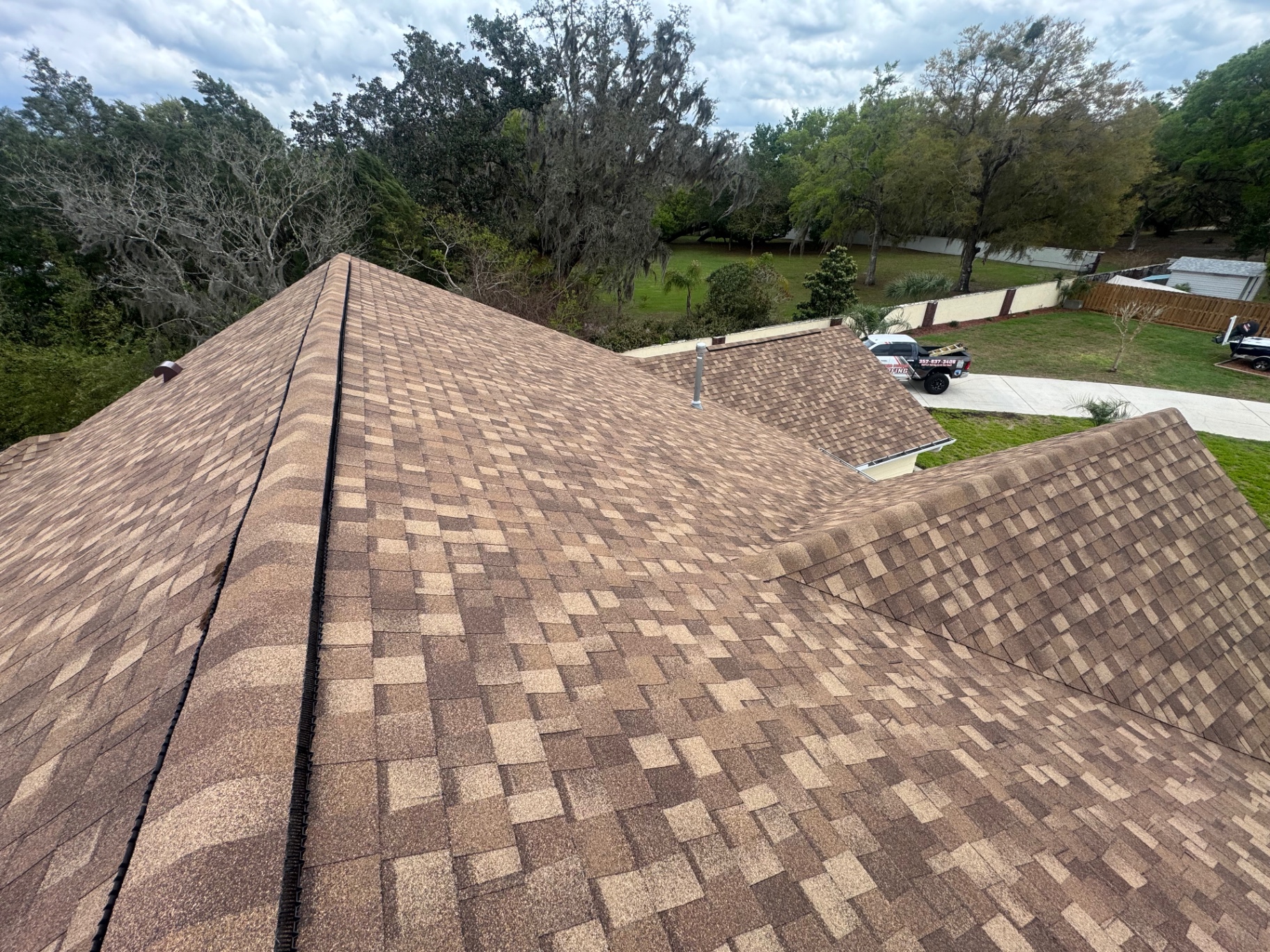 Warm-toned architectural shingle roof on residential home